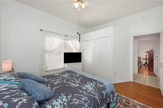 a view of a house with wooden fence