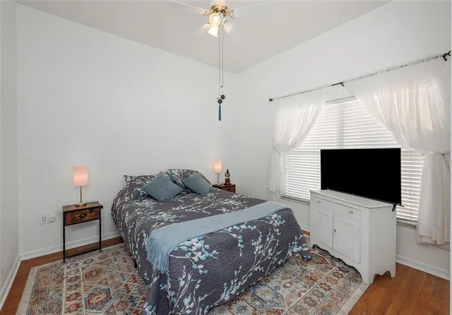 a view of a house with backyard and porch