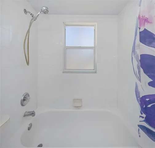 a view of a house with backyard porch and sitting area