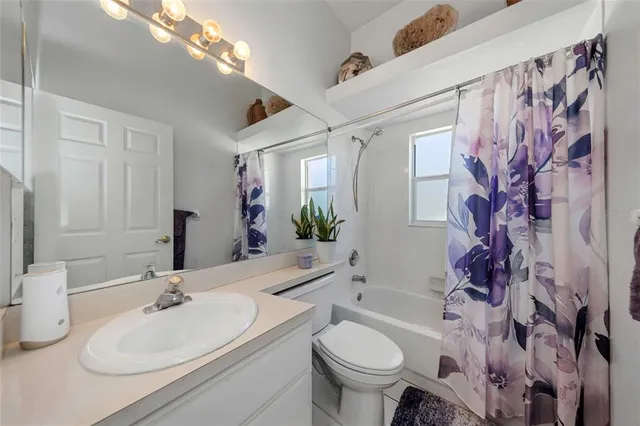 a view of a backyard with a swimming pool