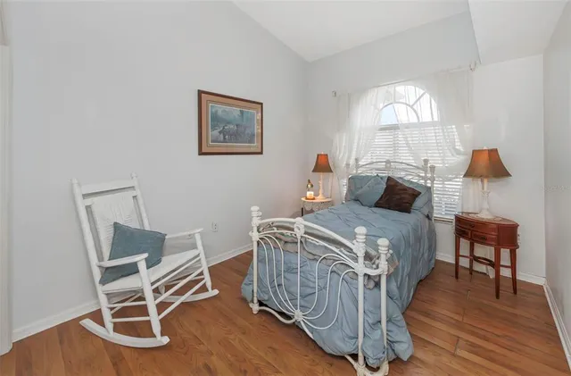 an aerial view of a house with garden space and street view