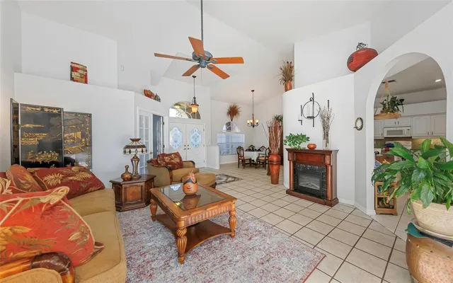 an aerial view of a house with swimming pool and porch