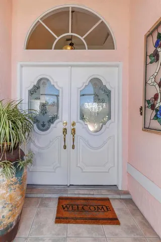 a living room with furniture a rug and a chandelier