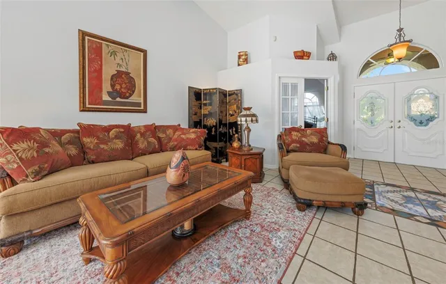 a large kitchen with kitchen island granite countertop a sink and a white stove