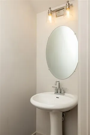 a bathroom with a sink and mirror