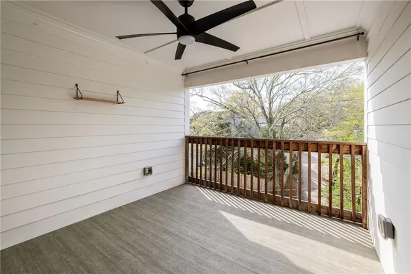 a view of a balcony with wooden floor