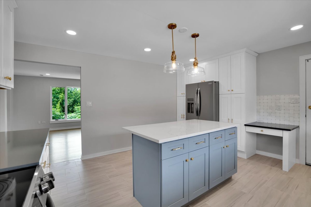 7330 Ogden Avenue, Unit 3 Riverside, IL 60546 - Photo 15 of 37 a view of a kitchen center island and wooden floor