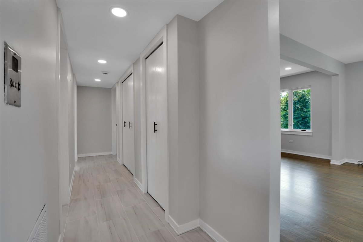 7330 Ogden Avenue, Unit 3 Riverside, IL 60546 - Photo 17 of 37 a view of a hallway with wooden floor and a window