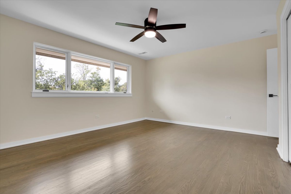 7330 Ogden Avenue, Unit 3 Riverside, IL 60546 - Photo 22 of 37 wooden floor in an empty room with a window