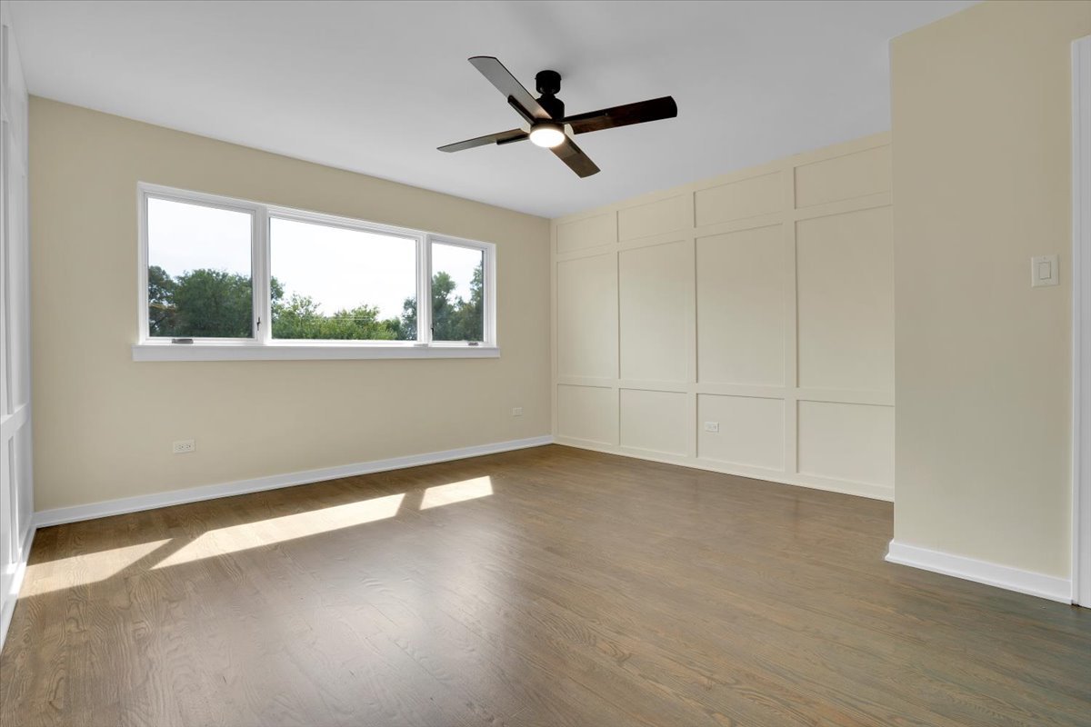 7330 Ogden Avenue, Unit 3 Riverside, IL 60546 - Photo 24 of 37 an empty room with wooden floor and windows