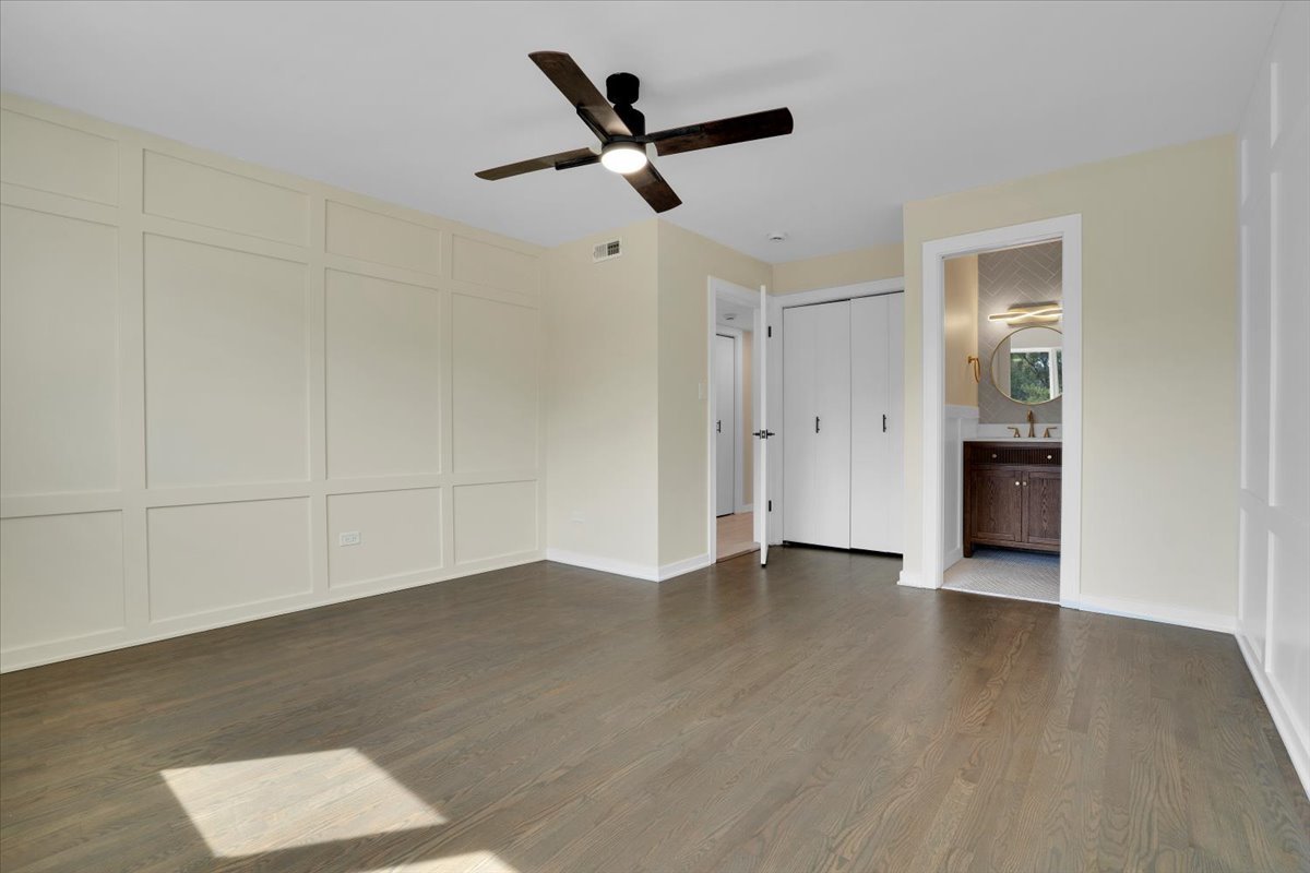 7330 Ogden Avenue, Unit 3 Riverside, IL 60546 - Photo 25 of 37 an empty room with wooden floor ceiling fan and windows