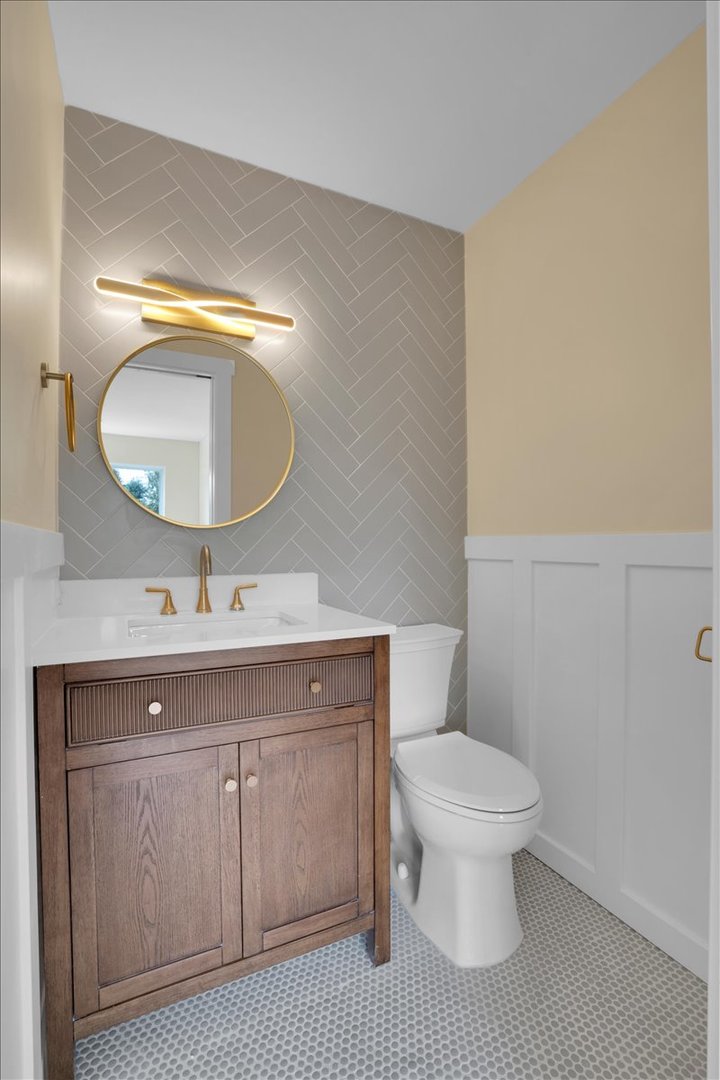 7330 Ogden Avenue, Unit 3 Riverside, IL 60546 - Photo 28 of 37 a bathroom with a sink a toilet and a mirror