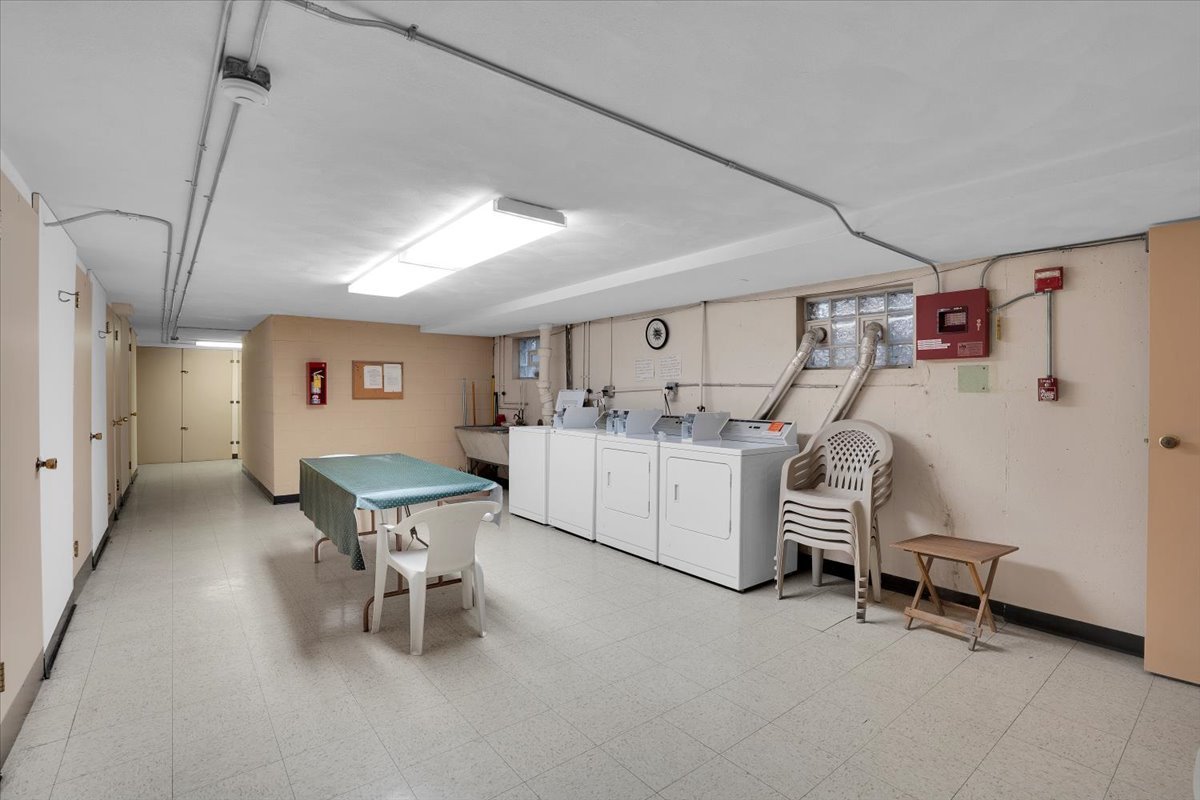 7330 Ogden Avenue, Unit 3 Riverside, IL 60546 - Photo 31 of 37 a living room with furniture and a table