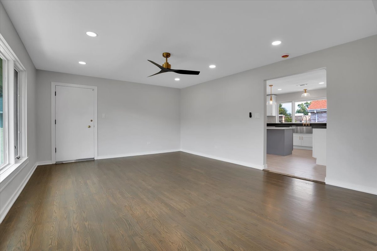 7330 Ogden Avenue, Unit 3 Riverside, IL 60546 - Photo 4 of 37 an empty room with wooden floor and windows