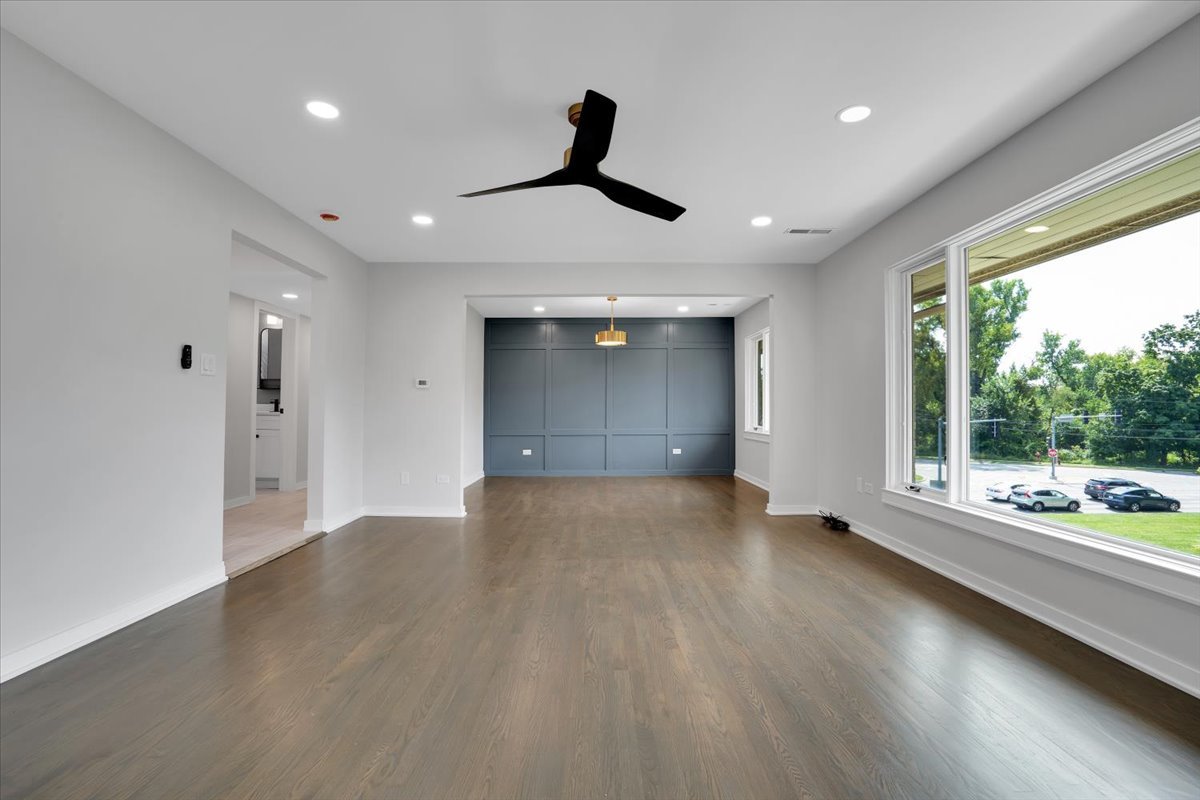 7330 Ogden Avenue, Unit 3 Riverside, IL 60546 - Photo 5 of 37 a view of an empty room with wooden floor and a window