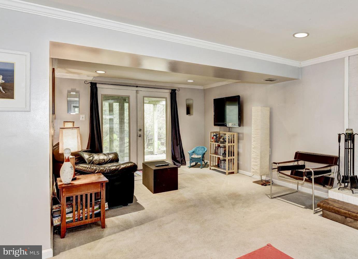 10932 Howland Drive Reston, VA 20191 - Photo 22 of 31 a bedroom with furniture and a large window