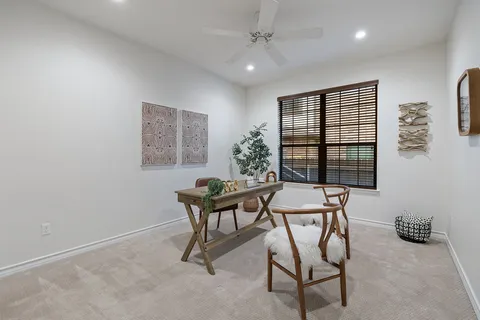 a work room with furniture and window