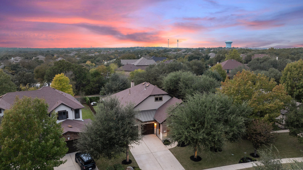 11217 Bastogne Loop Austin, TX 78739 - Photo 36 of 40 an aerial view of residential houses with outdoor space and trees