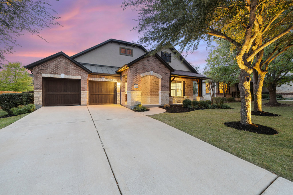 11217 Bastogne Loop Austin, TX 78739 - Photo 40 of 40 a front view of house with yard and green space