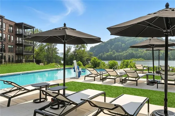 a view of a chairs and table in the patio with a yard