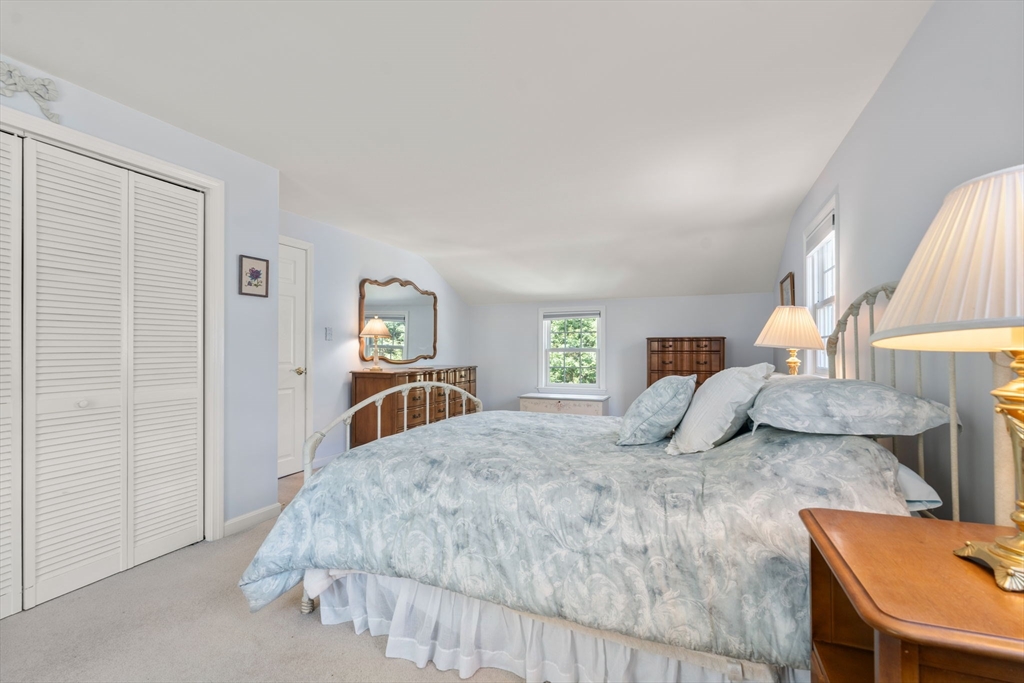 40 Amble Road Chelmsford, MA 01824 - Photo 16 of 26 a bedroom with a bed and a lamp on table