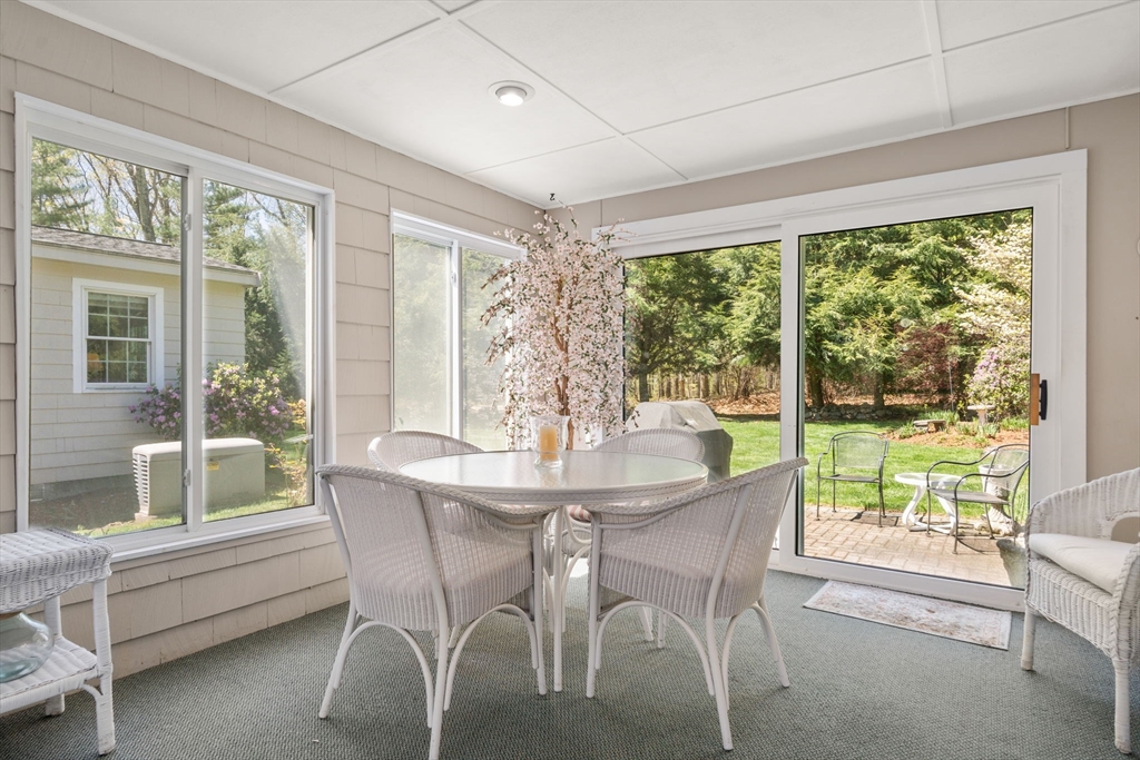 40 Amble Road Chelmsford, MA 01824 - Photo 21 of 26 a dining room with furniture a chandelier and wooden floor