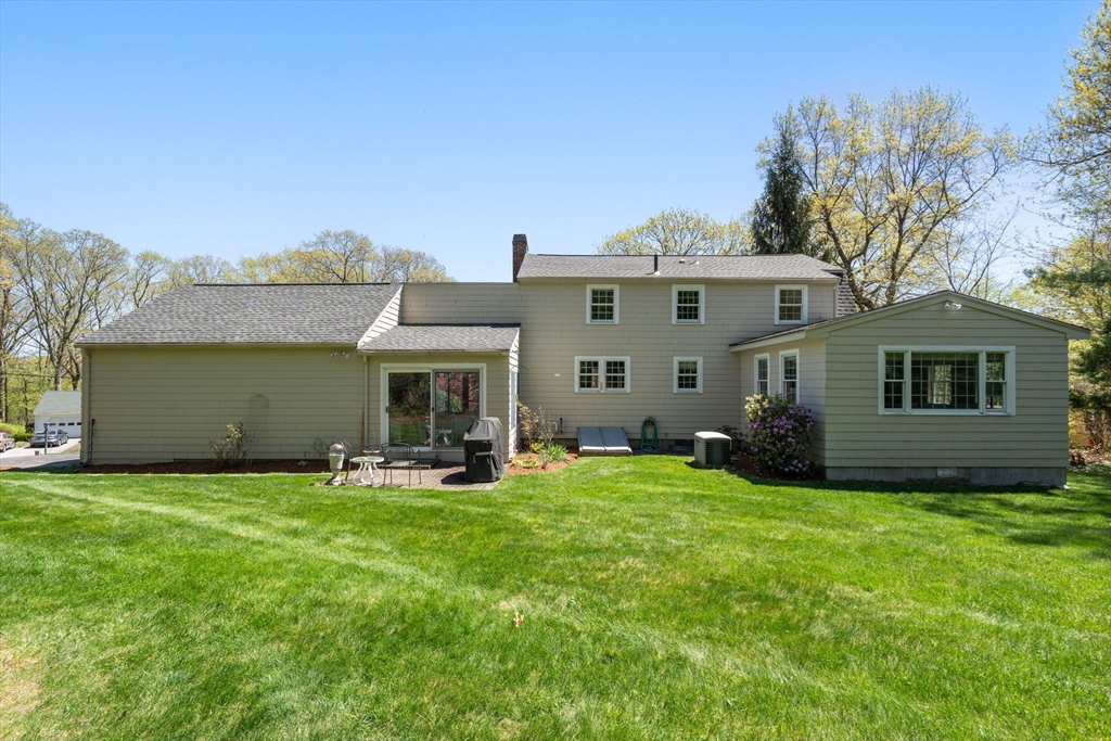40 Amble Road Chelmsford, MA 01824 - Photo 22 of 26 a view of a house with a yard and sitting area