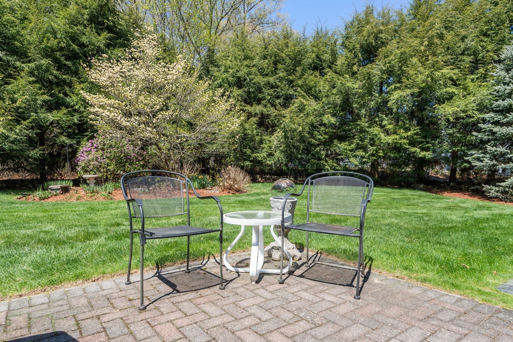 40 Amble Road Chelmsford, MA 01824 - Photo 24 of 26 a view of a two chairs in a backyard