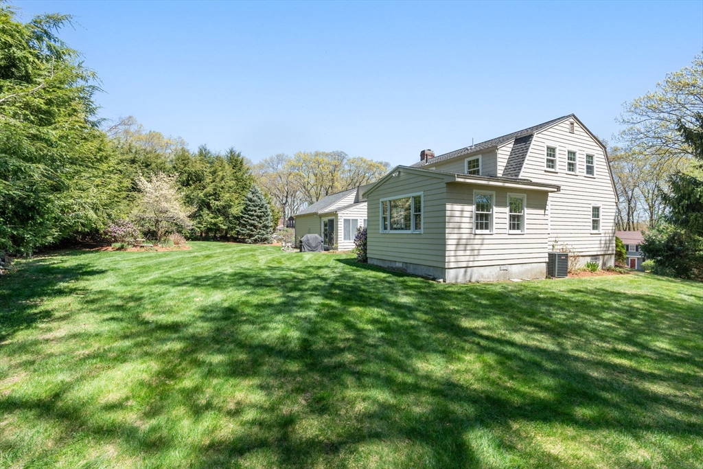 40 Amble Road Chelmsford, MA 01824 - Photo 25 of 26 a front view of a house with a yard