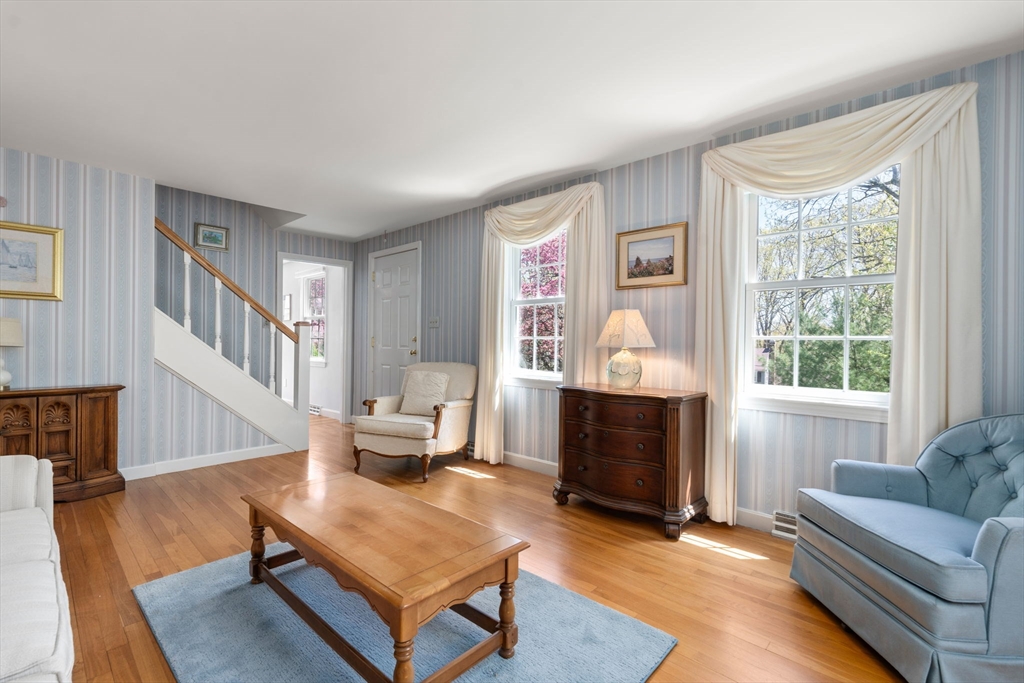 40 Amble Road Chelmsford, MA 01824 - Photo 3 of 26 a living room with furniture and a fireplace