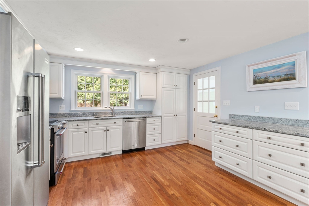 40 Amble Road Chelmsford, MA 01824 - Photo 9 of 26 a kitchen with granite countertop a refrigerator sink and cabinets