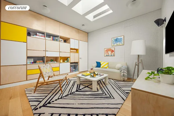 a bedroom with furniture and a large window
