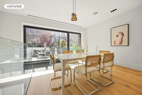 a kitchen with kitchen island a counter top space a sink stainless steel appliances and cabinets