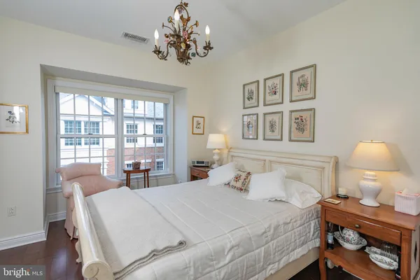 a bedroom with a bed and a table