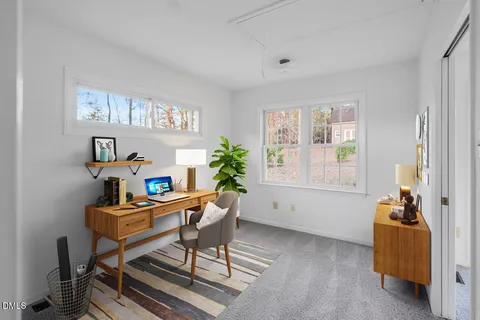a work room with furniture and a window