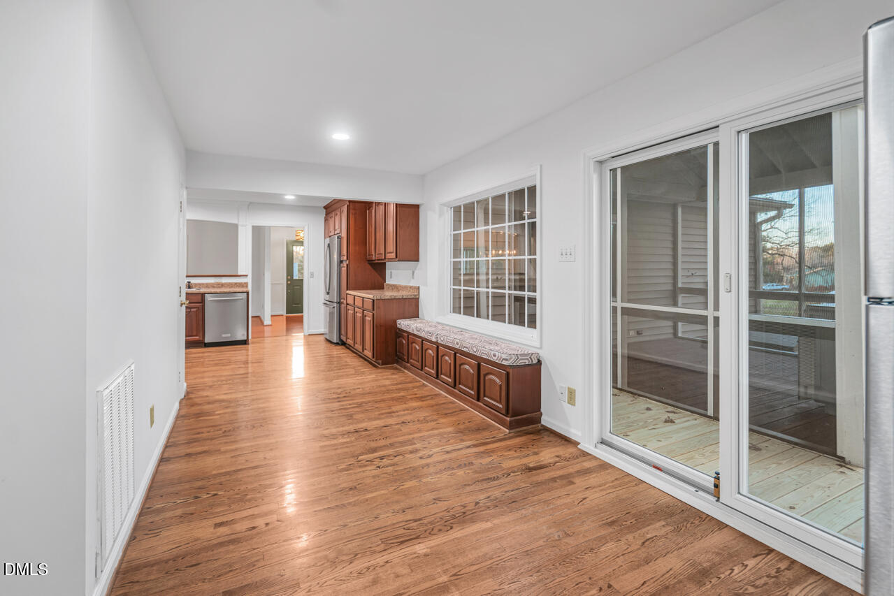 13018 Meadow Ridge Drive Rougemont, NC 27572 - Photo 15 of 26 a view of a living room with furniture and wooden floor