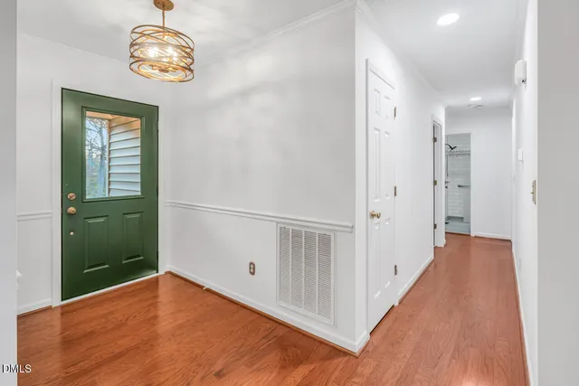 a spacious bedroom with a bed and window