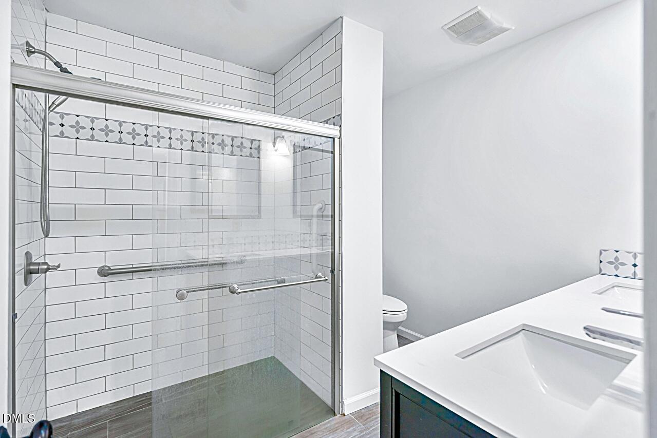 13018 Meadow Ridge Drive Rougemont, NC 27572 - Photo 20 of 26 a bathroom with a sink and a shower