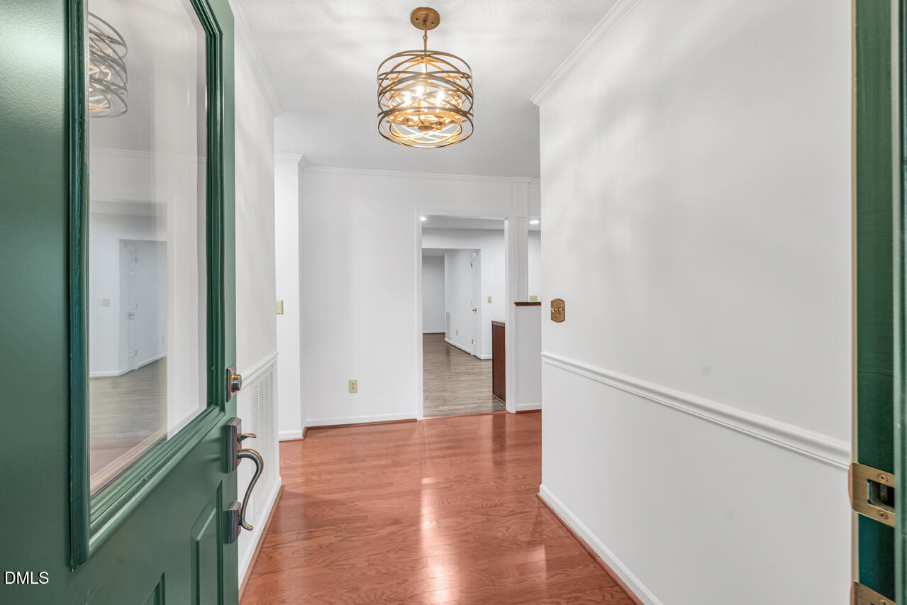 13018 Meadow Ridge Drive Rougemont, NC 27572 - Photo 3 of 26 a view of a hallway with wooden floor