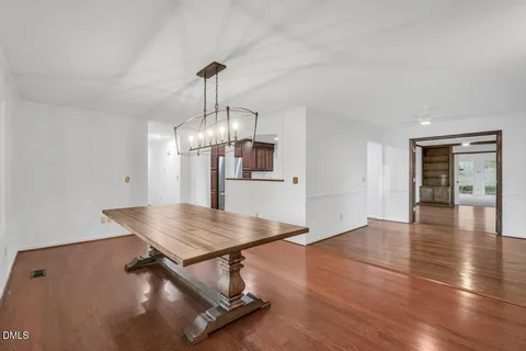 a room with lots of counter space and wooden floor