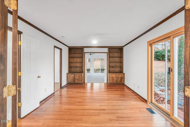 a view of an entryway with wooden floor