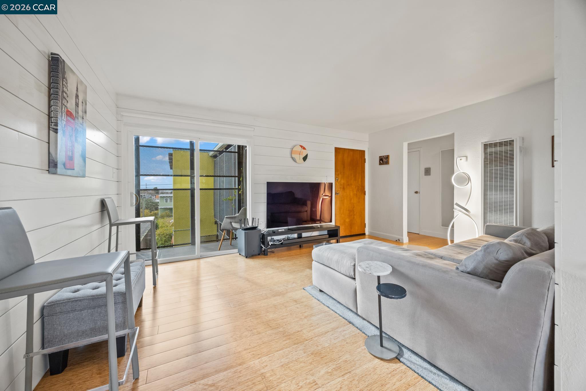 2327 Tenth Street, Unit 4 Berkeley, CA 94710 - Photo 1 of 39 a living room with furniture and a flat screen tv