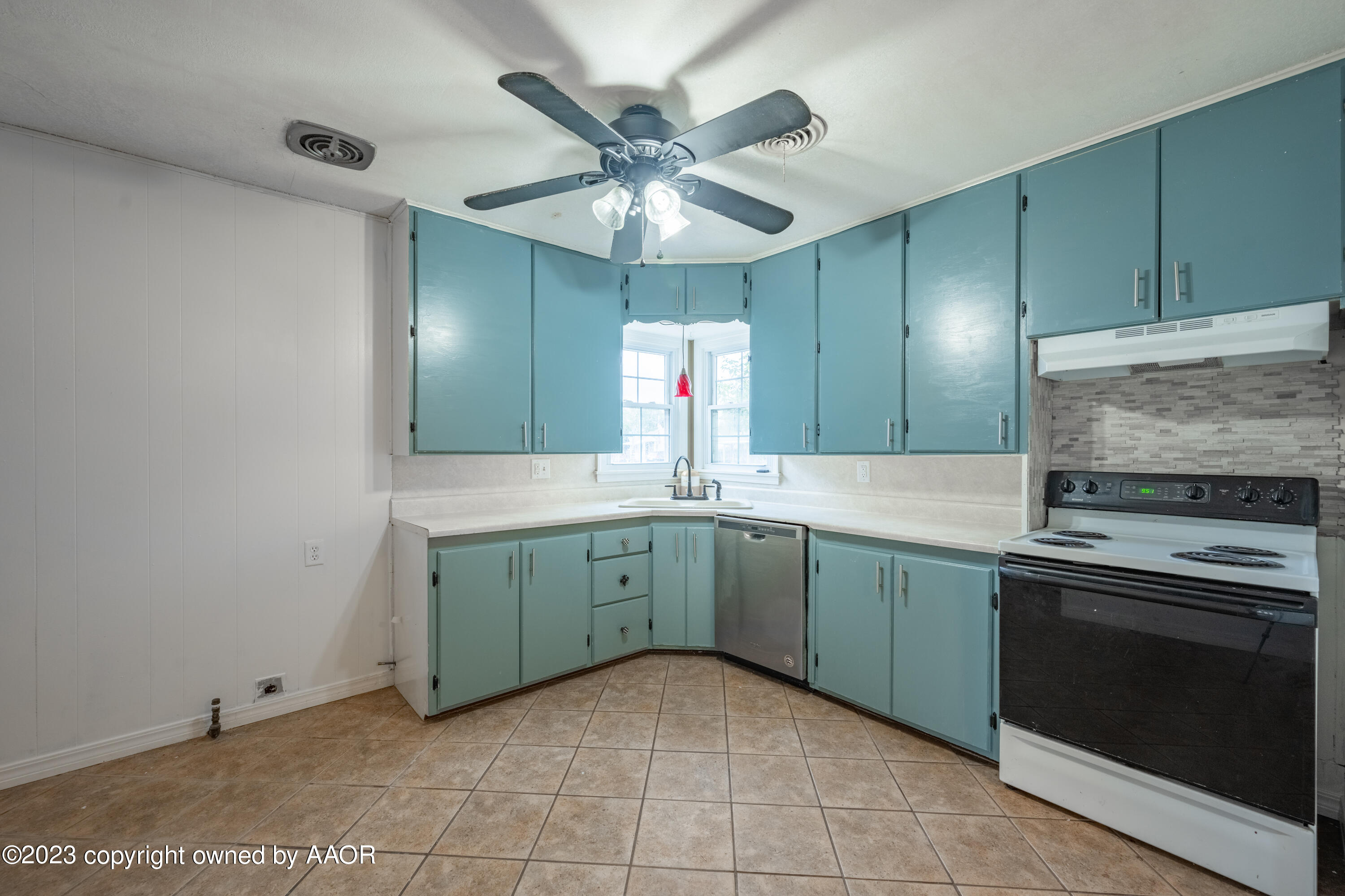 4300 Cline Road Amarillo, TX 79110 - Photo 8 of 21 a kitchen with a sink and a stove top oven