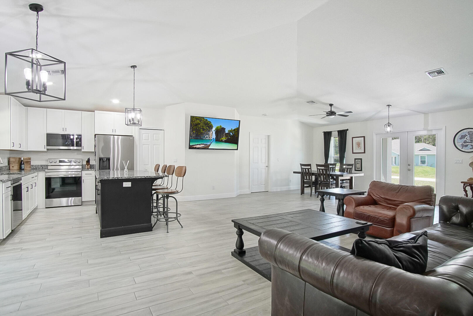 5302 Seagrape Drive Fort Pierce, FL 34982 - Photo 11 of 35 a living room with furniture and a wooden floor