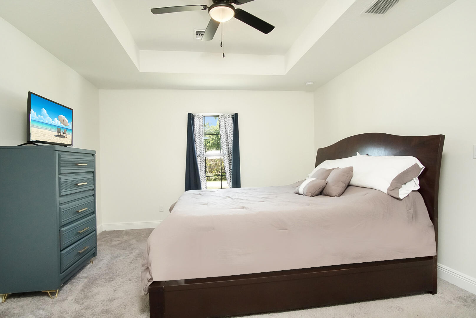 5302 Seagrape Drive Fort Pierce, FL 34982 - Photo 12 of 35 a bedroom with a bed and dresser