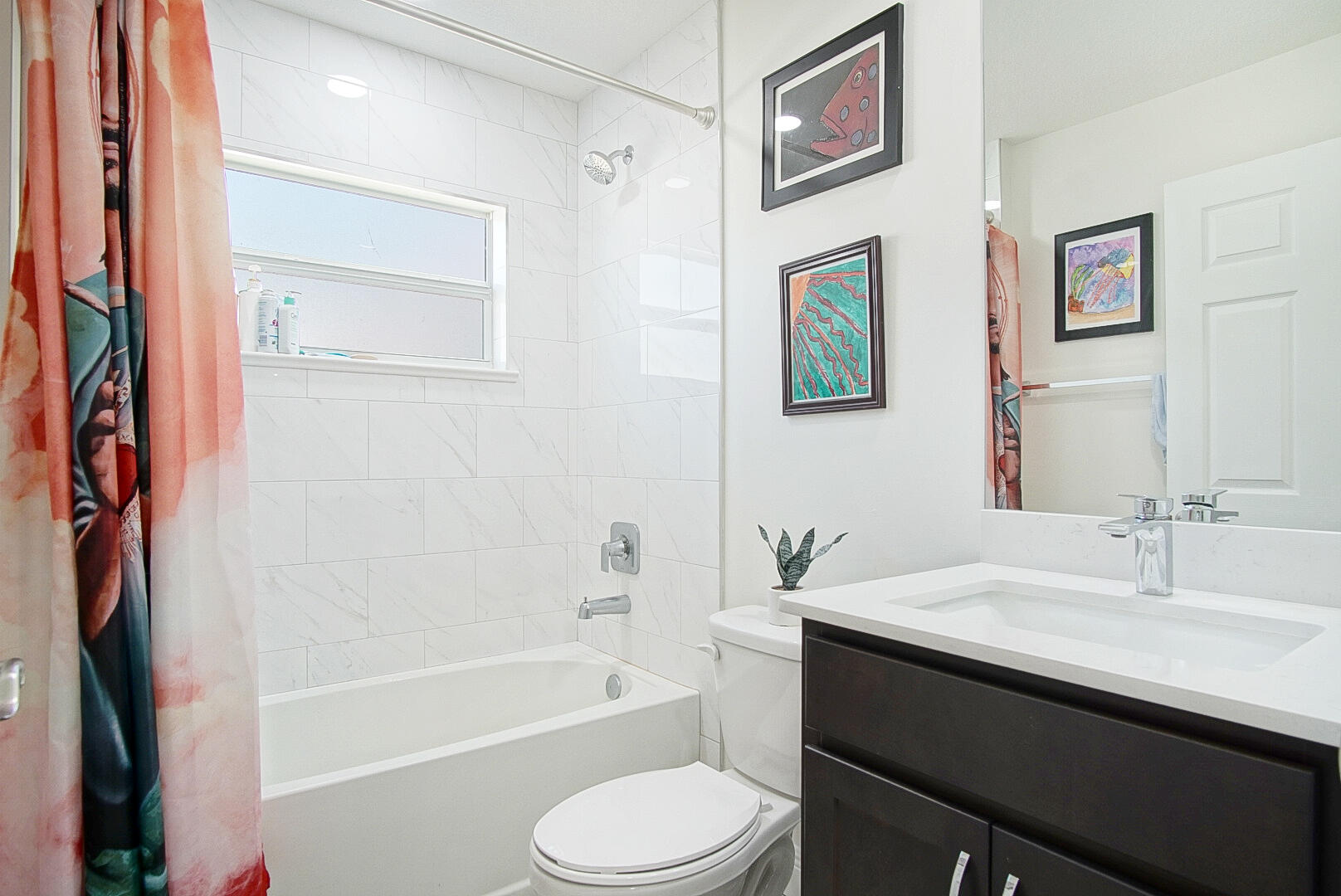 5302 Seagrape Drive Fort Pierce, FL 34982 - Photo 18 of 35 a bathroom with a sink a toilet and a bathtub