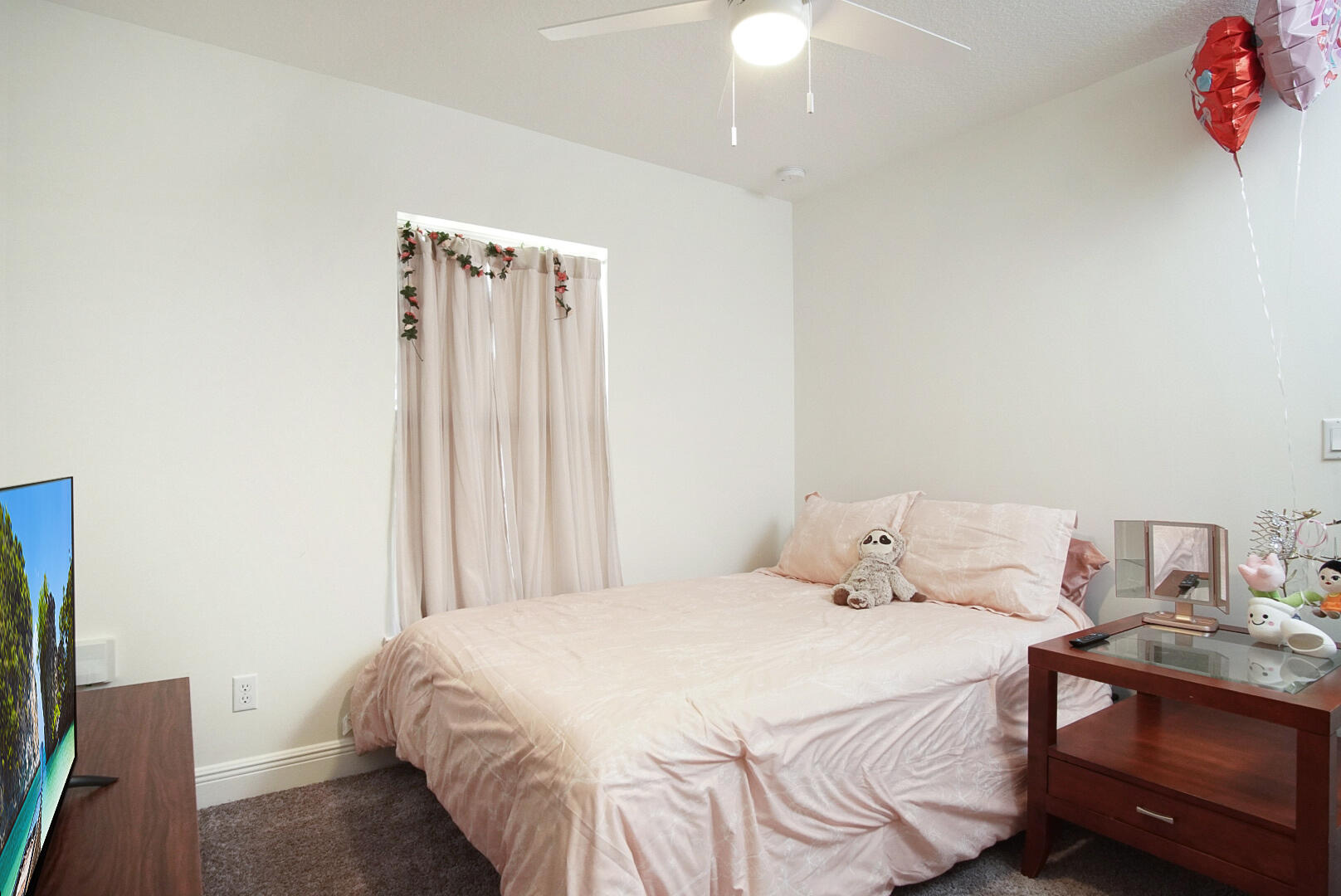 5302 Seagrape Drive Fort Pierce, FL 34982 - Photo 19 of 35 a bedroom with a bed and a chandelier