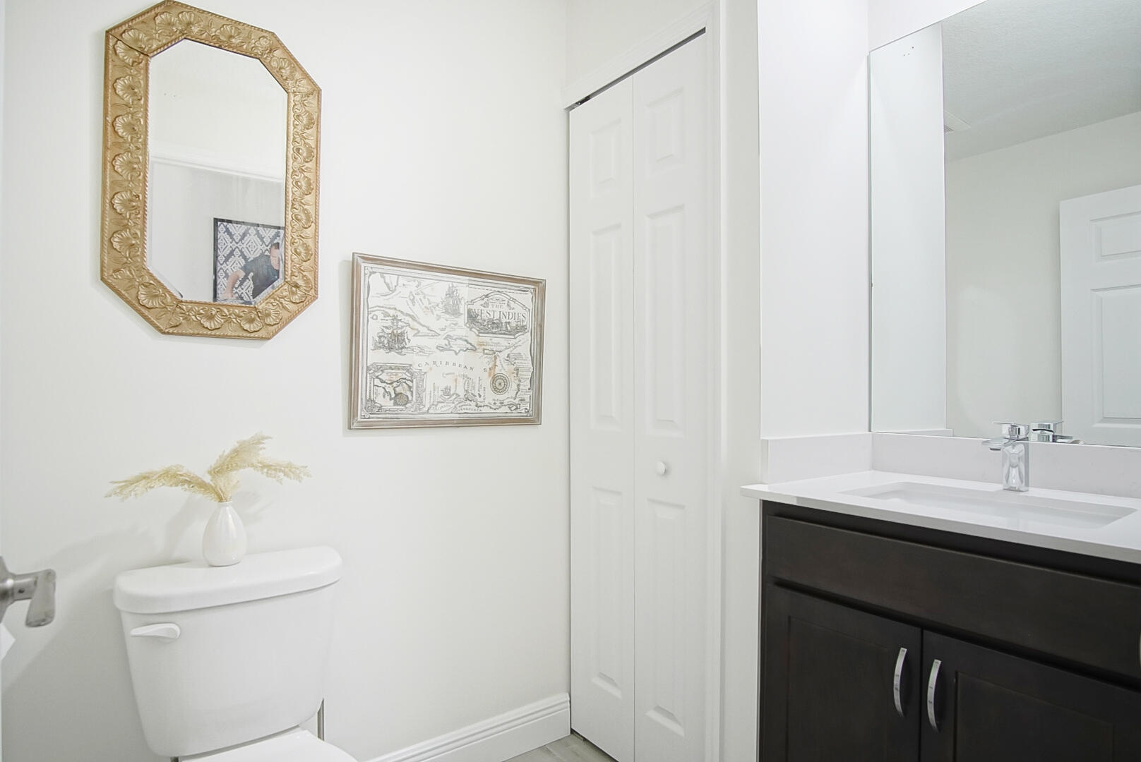 5302 Seagrape Drive Fort Pierce, FL 34982 - Photo 21 of 35 a bathroom with a sink and a mirror