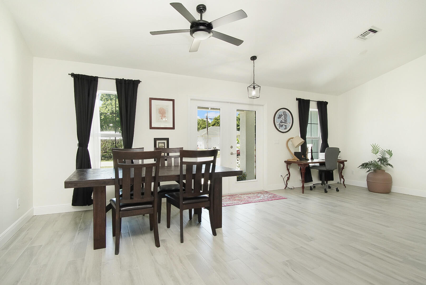 5302 Seagrape Drive Fort Pierce, FL 34982 - Photo 4 of 35 a view of a dining room with furniture and window
