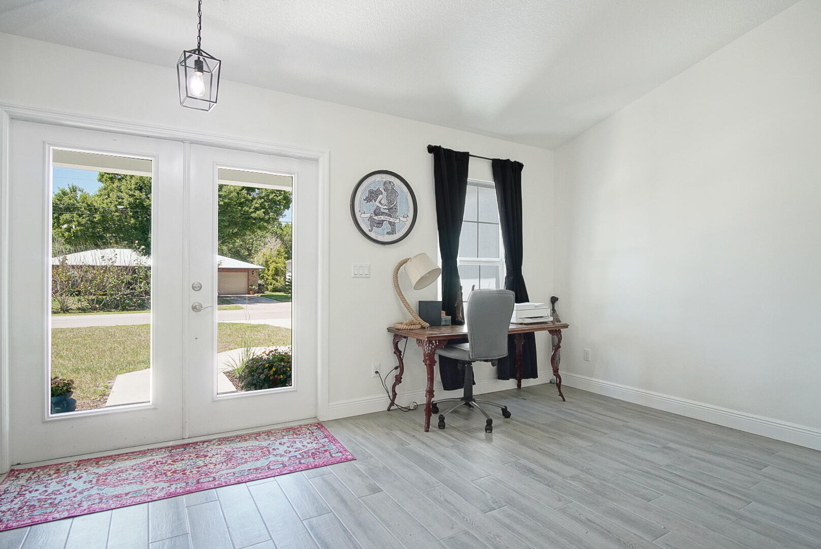5302 Seagrape Drive Fort Pierce, FL 34982 - Photo 5 of 35 a view of workspace with wooden floor and windows
